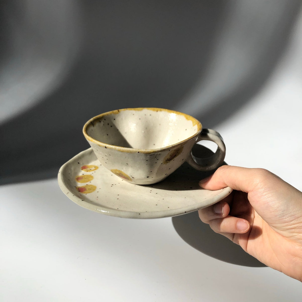Hiroshi Hirai: Heart Shaped Cup & Saucer Set, Yellow Accents - yunomi-jp.pro