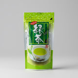 A package of NaturaliTea Yabukita green tea with a picture of a tea bag in a cup and green leaves around it.